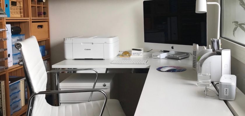 canon printer ob the white table with mac