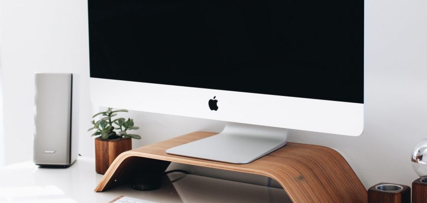 gray imac on the table
