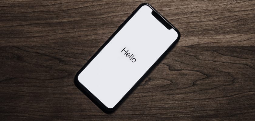 iphone on brown wooden table