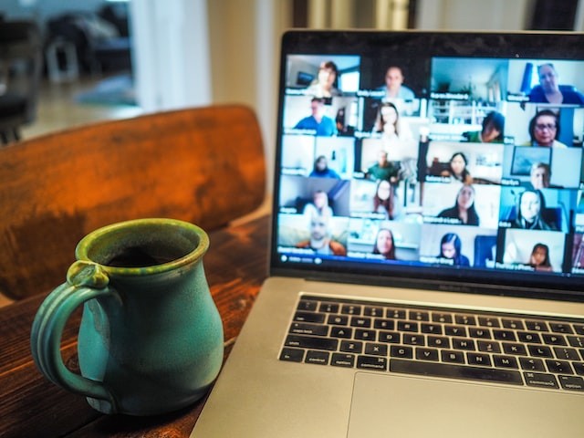 macbook displaying group of people