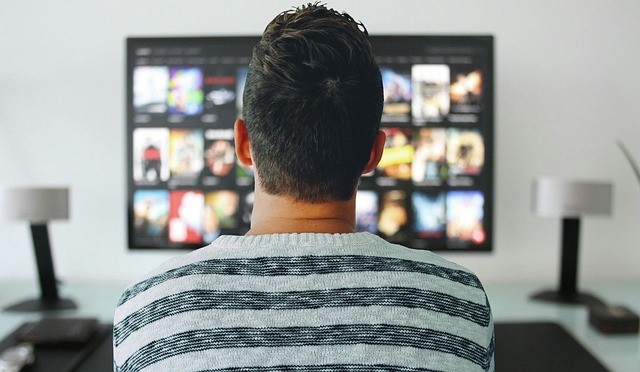 man watching tv in the room