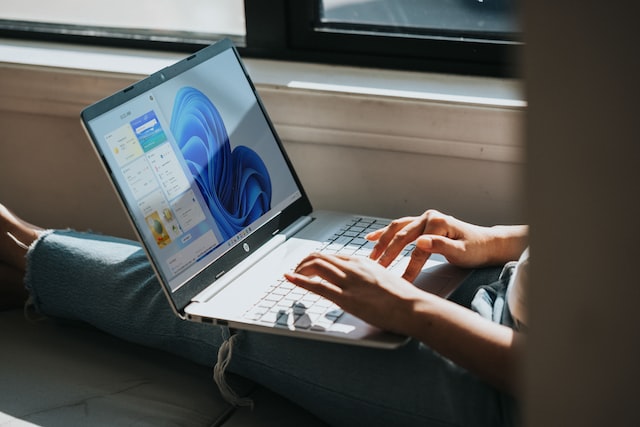 person using computer with windows os