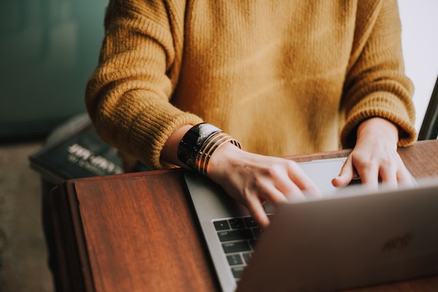 person using laptop macbook