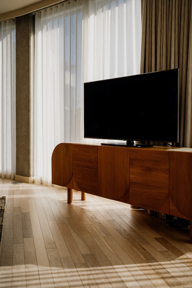tv on brown wooden table