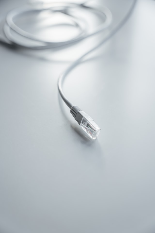 white ethernet cable on the white table