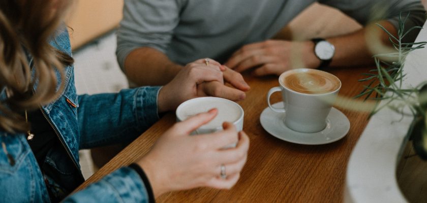 persons drinking coffee in cafe